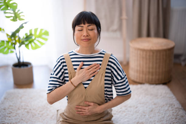 istock Beautiful Asian Woman Meditating 2005956706