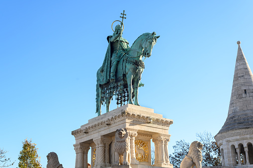 The Statue of Saint Stephen (Stephen I, first king of Hungary), in the southern court of the Fisherman's Bastion in Budapest. It was made by sculpture Alajos Stróbl in 1906.\n\nBUDAPEST, HUNGARY - DECEMBER, 16, 2023
