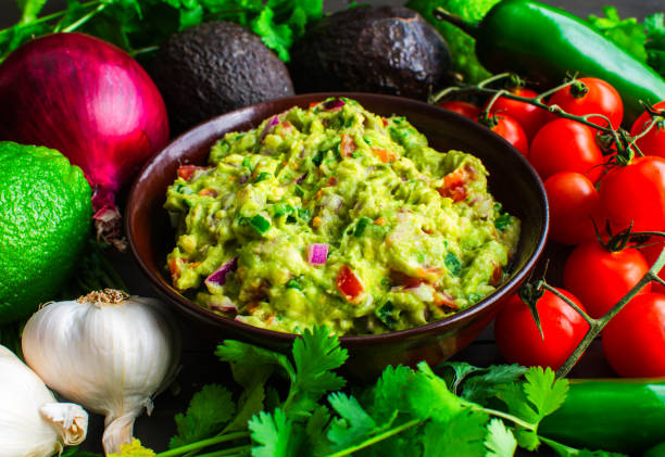 istock Bowl of Guacamole Surrounded by Fresh Ingredients 2005999736
