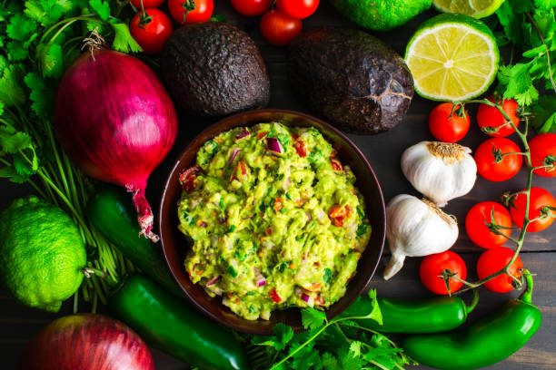 istock Bowl of Guacamole Surrounded by Fresh Ingredients 2005999754