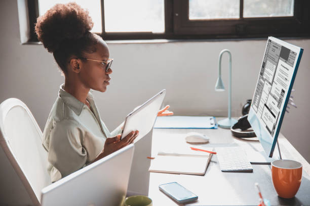 istock Satisfied black female CEO working at office desk 2006003396