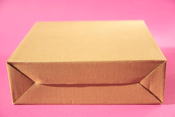 Empty cardboard box on blue background. Mockup for design.