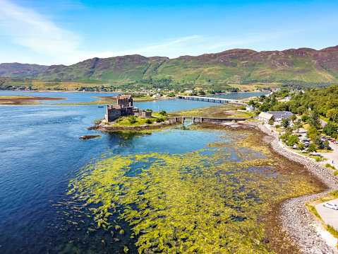 8th August, 2021 - Castle Eilean Donan, Scotland: The iconic Castle Eilean Donan stands majestically at the point where three Scottish lochs meet, its historic walls and towers reflecting centuries of history. This image captures the timeless beauty and enduring legacy of one of Scotland's most photographed and beloved castles, set against a dramatic backdrop of water and sky.