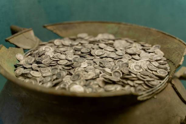 istock Coins. Old coins are in a jug. 2006074078