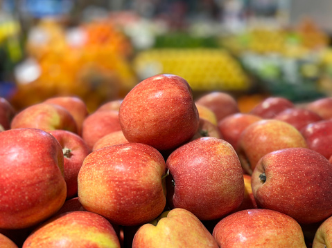 Close up photo of fresh apples in a supermarket grocery stalls.