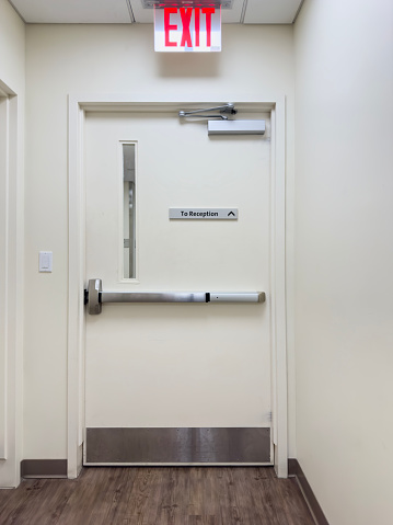 Empty long white hospital corridor, modern interior. Sterile resuscitation floor in the treatment center