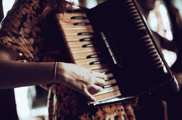 istock Woman playing the accordion. 2006079868