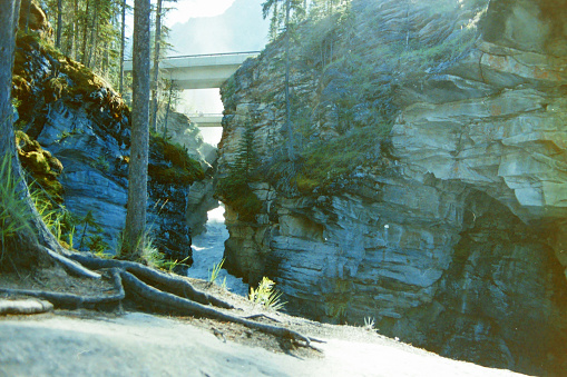 A waterfall in the Rocky Mountains. From old film stock in 1989