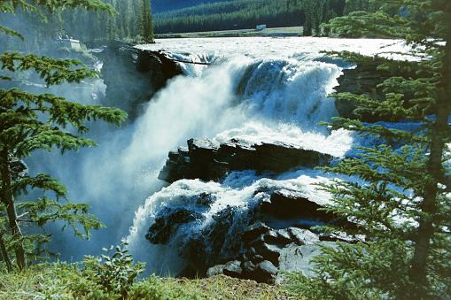 A waterfall in the Rocky Mountains. From old film stock in 1989