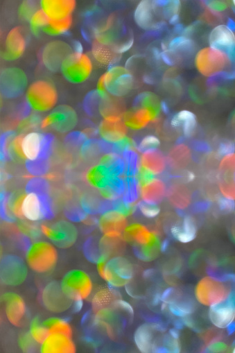 Extreme macro shot of defocused bokeh background multicolored silver details with multiple sparkles