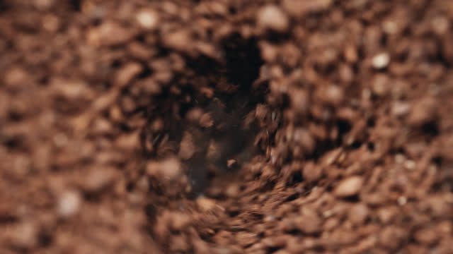 SLO MO Extreme Closeup Shot of Coffee Grinder Making Coffee Powder