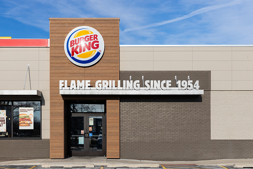 Joliet, IL, USA - February 12, 2024: A Burger King Restaurant with a modern facade with the logo and saying, \