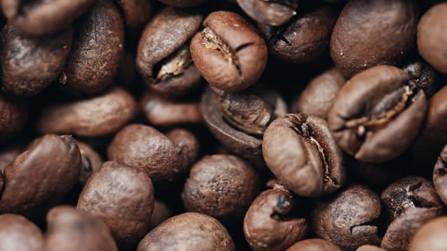 SLO MO Extreme Closeup Shot of Roasted Coffee Beans