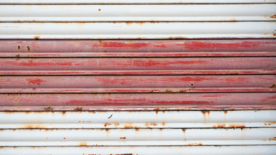 White and red rusty garage sheet