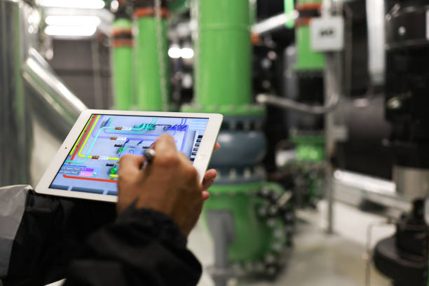 istock Mechanical Engineer using a digital tablet to Examine the Pipeline  system of cooling installation 2006176695