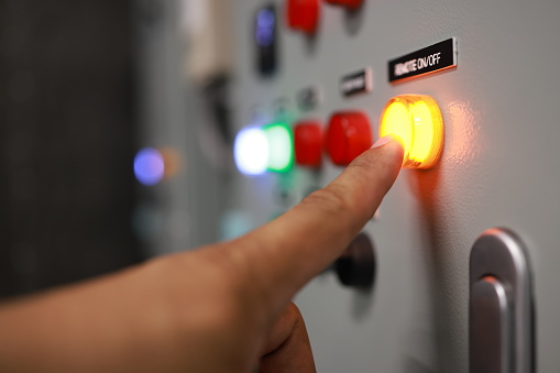 Control panel with indicating orange  lights and push buttons expression alarm sign