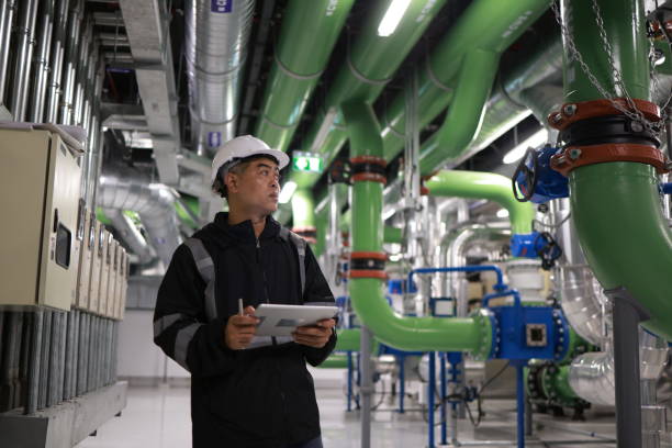 istock The male engineer  is working on a Cooling system pipeline  with a tablet 2006177235