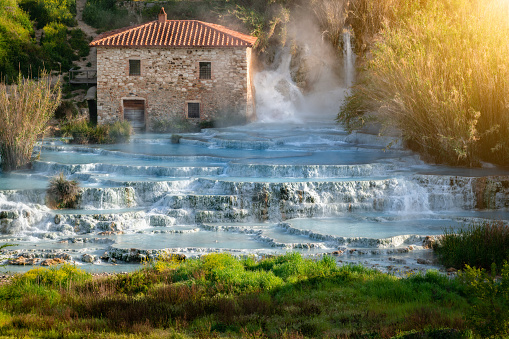 Empty natural spa with turquoise water at Saturnia thermal baths, in Tuscany, Italy. Le Cascate del Mulino is a perfect place to relax in waterfalls and hot springs.