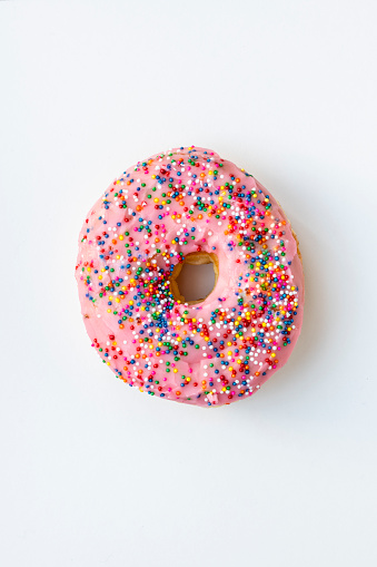 Doughnut with sprinkles  on white background