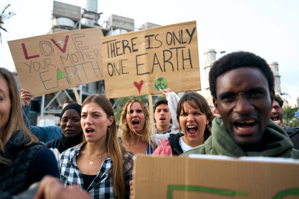 istock Group multiracial nonconforming persons demonstration against pollution factories angrily shouting. 2006188371