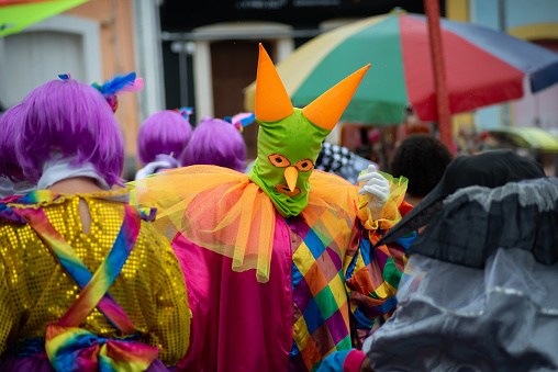 Maragogipe, Bahia, Brazil - February 11, 2024: Group of people in costume and masks are seen having fun during the carnival in the city of Maragogipe, in Bahia.