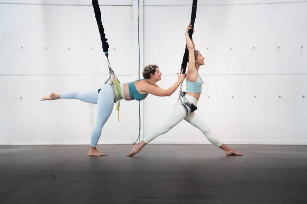 Adult women practice bungee workout