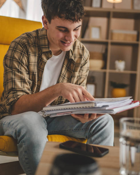 istock young caucasian man student study at home learn exam or prepare lesson 2006205295