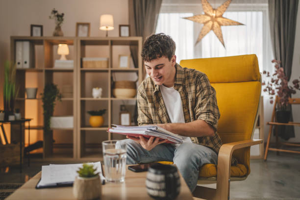istock young caucasian man student study at home learn exam or prepare lesson 2006208431