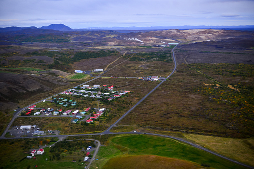 Aerial view of Reykjahlid village surrounded by the volcanic landscape around Lake Mývatn, northern Iceland.