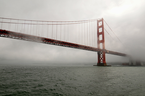 A fog-shrouded Golden Gate Bridge, San Francisco, California, USA.