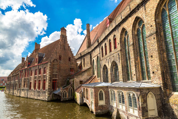 Houses along the canal in Bruges in a beautiful summer day, Belgium
