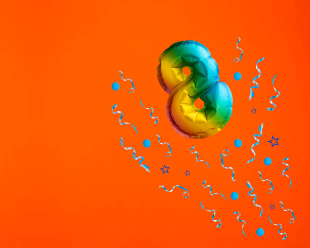 istock Confetti explosion with number 8 balloon - Celebration on orange background. Birthday card 2006274995