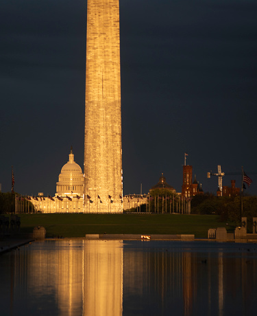 Sunset, Reflecting Pool. 'Alpenglow' on the Washington Monument and US Capitol.
