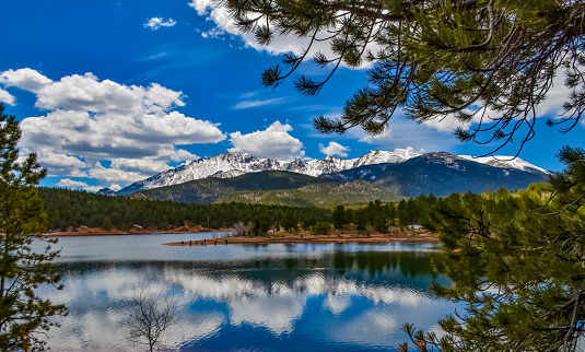 Pikes Peak panorama. Snow-capped and forested mountains near a mountain lake, Pikes Peak Mountains in Colorado Spring, Colorado, USA