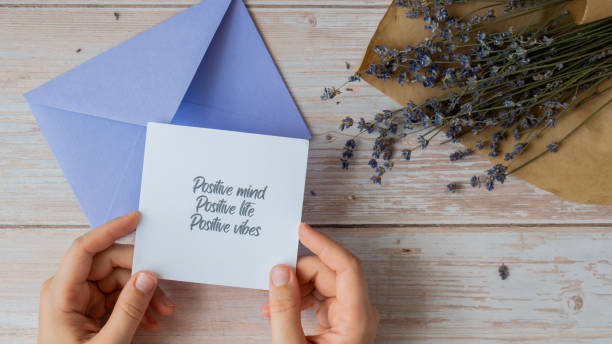 istock POSITIVE MIND LIFE VIBES text on supportive message paper note reminder from violet envelope. Flat lay composition dry lavender flowers. Concept of inner happiness, slowing-down digital detox personal fulfillment 2006354241