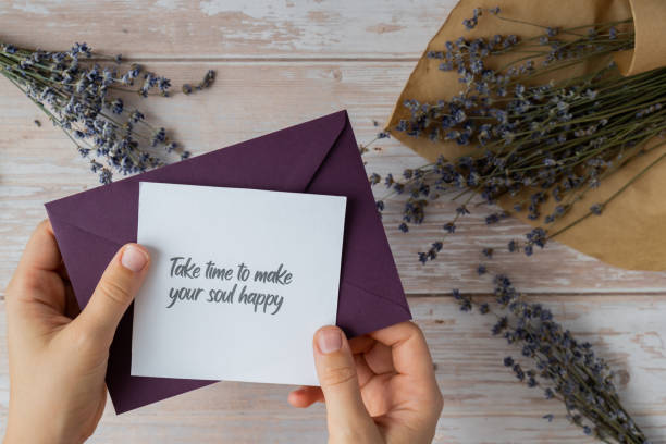 istock TAKE TIME TO MAKE YOUR SOUL HAPPY text on supportive message paper note reminder from green envelope. Flat lay composition dry lavender flowers. Concept of inner happiness, slowing-down digital detox personal fulfillment 2006358896