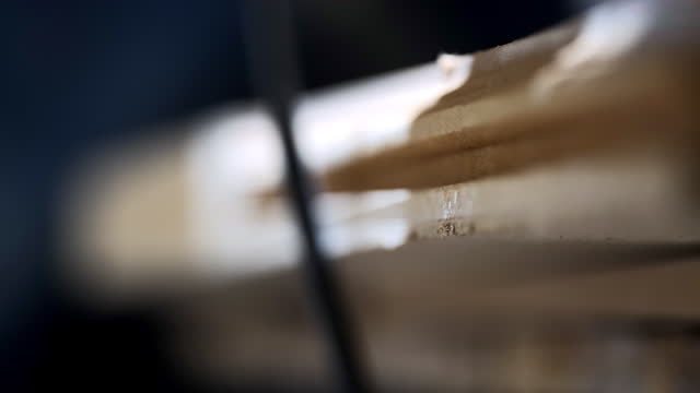 The macro process of skillfully shaping the edge of a wood board with a router