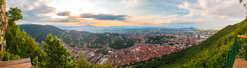Brasov, Transylvania. Romania. Aerial panoramic view of the old town and Council Square, Aerial twilight cityscape of Brasov city, Romania