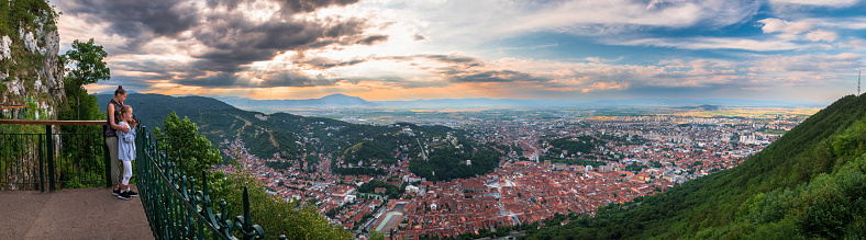 Brasov, Transylvania. Romania. Aerial panoramic view of the old town and Council Square, Aerial twilight cityscape of Brasov city, Romania