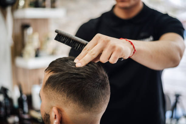 istock Barber Giving A Haircut in His Shop 2006424251