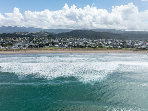 An aerial view from behind the surf looking back into Whangamata township, one of New Zealand's most popular summer destinations.