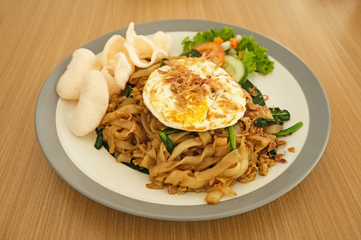 Kwetiaw or Kwetiau, fried rice noodles with meatballs and vegetables. Popular in Indonesia