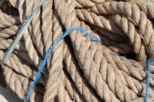 huge pile of broken rope used to pull ships leaning in port
