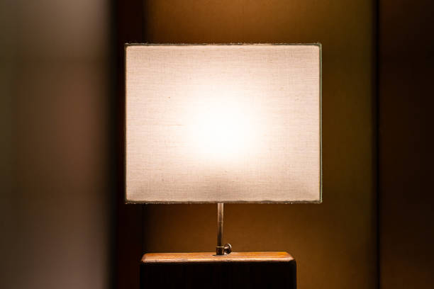Luminous modern bedsides lamp at night.