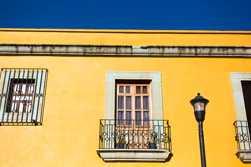 Oaxaca, Mexico: Sunlit Vibrant Yellow Downtown Building