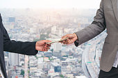 close-up-hands-giving-money-bribe-payment-hands-holding-dollar-bill-bribery-financial-economy.jpg?b=1&s=170x170&k=20&c=WUMd8YMbQKaJWw4-VFpPwK0gOrM4LQKUvg8TkAS3SmU=