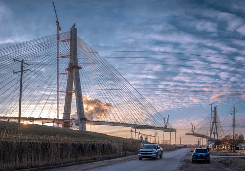 The Gordie Howe International Bridge, is expected to be fully constructed and open for business by 2024/2025.   The bridge will link Detroit, Michigan with Windsor, Ontario.