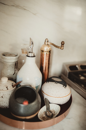 Round tray of kitchen spices next to stove