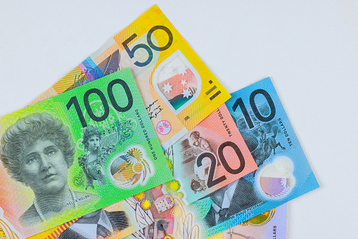 Various Australian dollars currency banknotes in different denominations on white background
