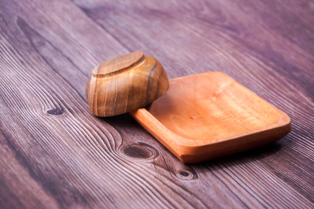 a dining place made of brown wood with various shapes on a wooden table